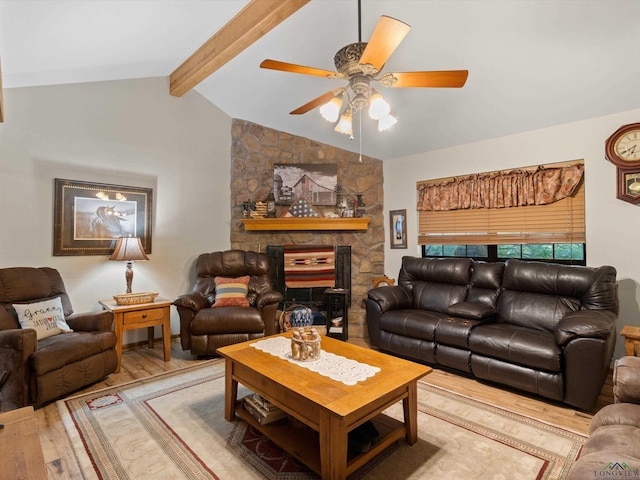 living room featuring ceiling fan, lofted ceiling with beams, and wood-type flooring