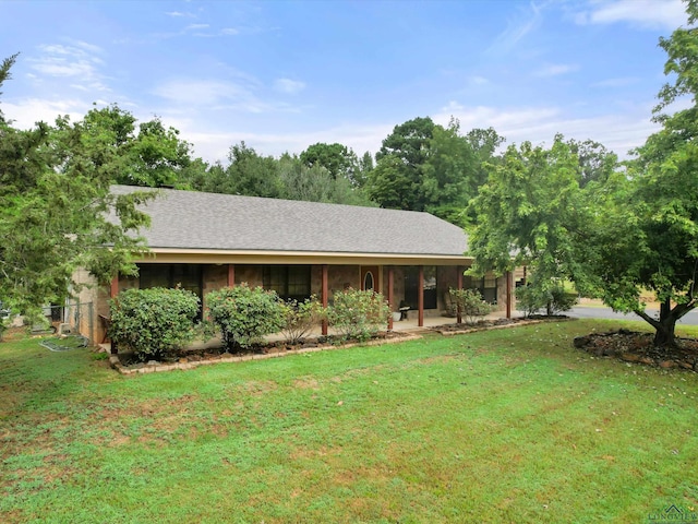 ranch-style home with a front lawn