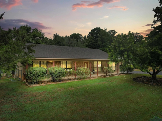 view of front of property with a lawn