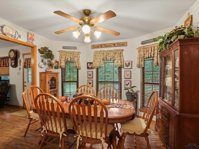 dining area featuring hardwood / wood-style floors and ceiling fan