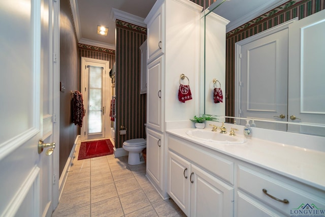bathroom featuring vanity, wallpapered walls, tile patterned floors, crown molding, and toilet