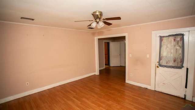 unfurnished room featuring wood-type flooring, ceiling fan, and crown molding