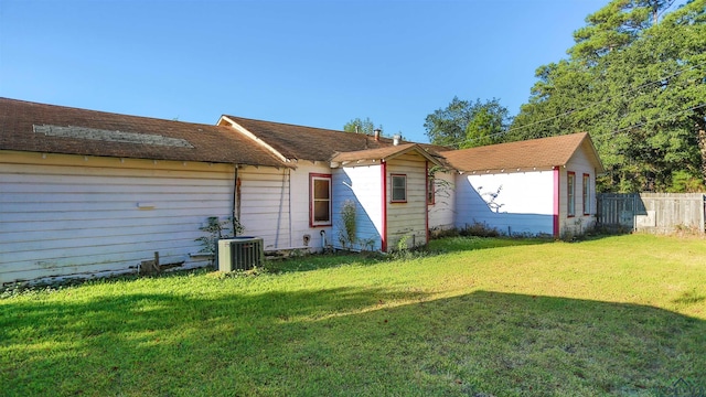 exterior space featuring a yard and cooling unit