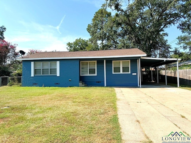 ranch-style home featuring a front lawn and a carport