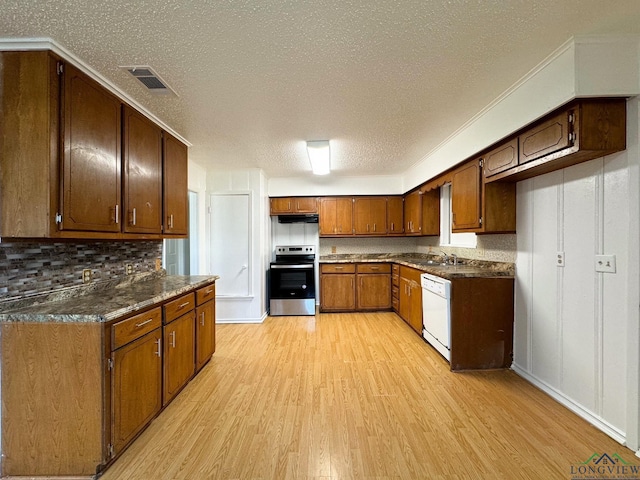 kitchen with tasteful backsplash, stainless steel electric range oven, a textured ceiling, light wood-type flooring, and white dishwasher