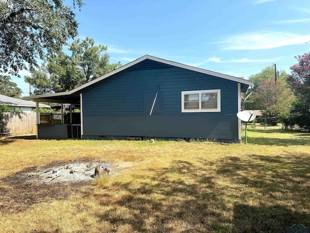 view of home's exterior featuring a yard