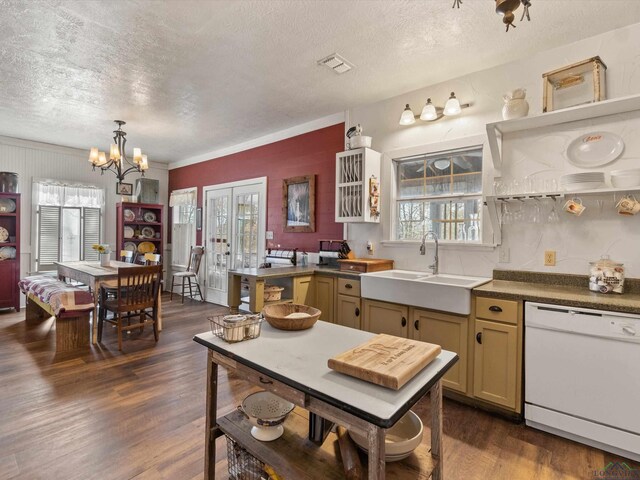 kitchen with sink, an inviting chandelier, dishwasher, dark hardwood / wood-style floors, and hanging light fixtures