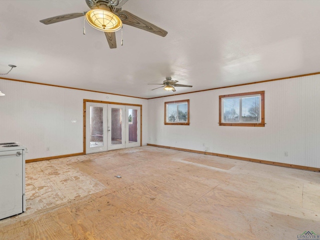 unfurnished living room with ceiling fan and crown molding