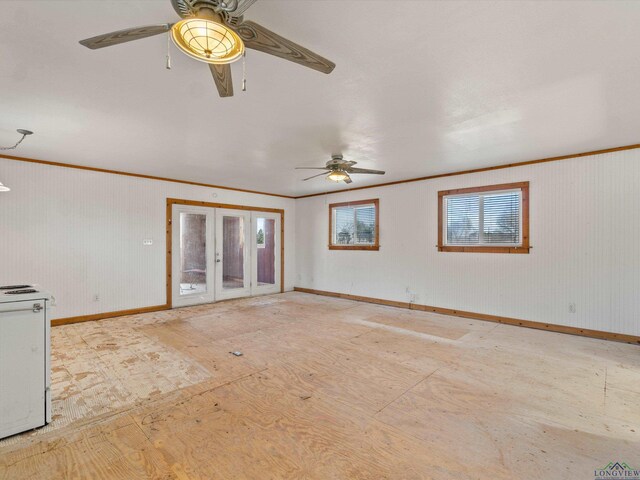 unfurnished living room with ceiling fan and crown molding