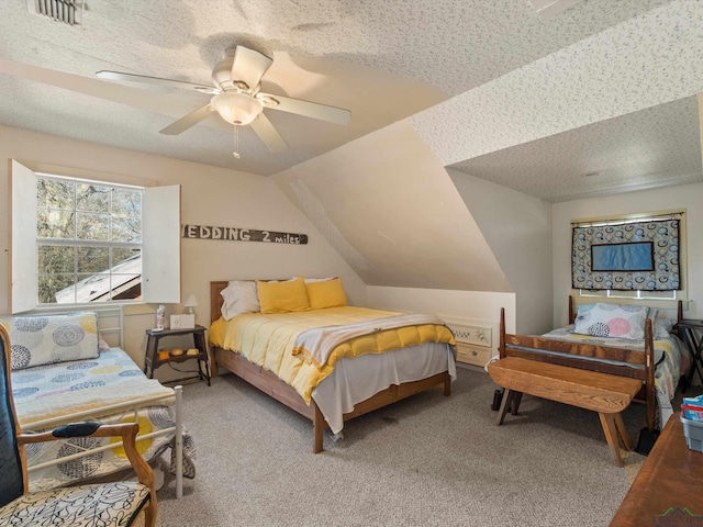 bedroom featuring a textured ceiling, ceiling fan, carpet, and lofted ceiling