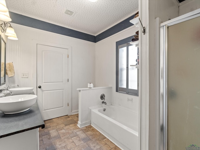 bathroom featuring vanity and independent shower and bath