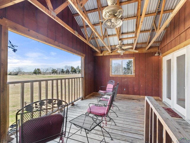 wooden deck featuring ceiling fan