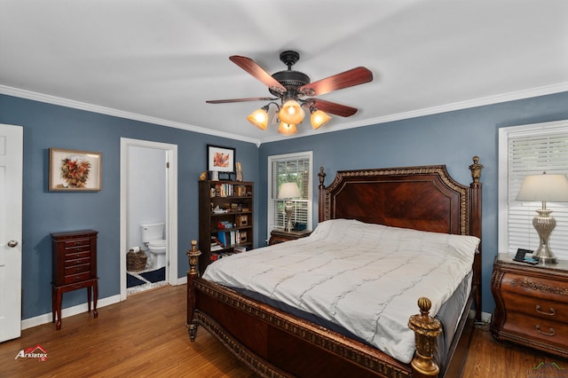 bedroom with connected bathroom, ceiling fan, dark hardwood / wood-style flooring, and crown molding