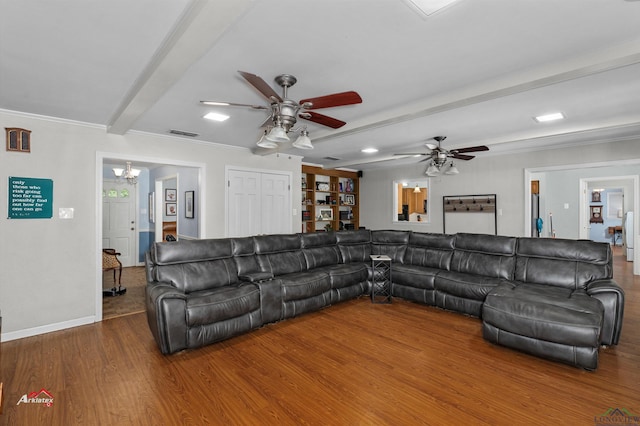 living room with ceiling fan, beam ceiling, wood-type flooring, and ornamental molding