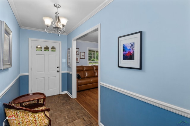 foyer entrance featuring dark parquet flooring, a chandelier, and ornamental molding