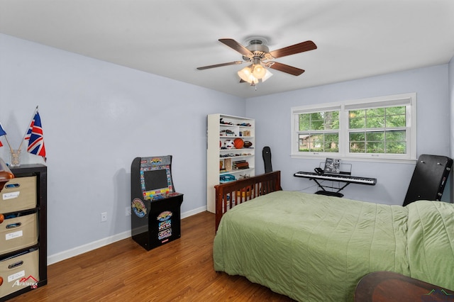 bedroom with hardwood / wood-style flooring and ceiling fan