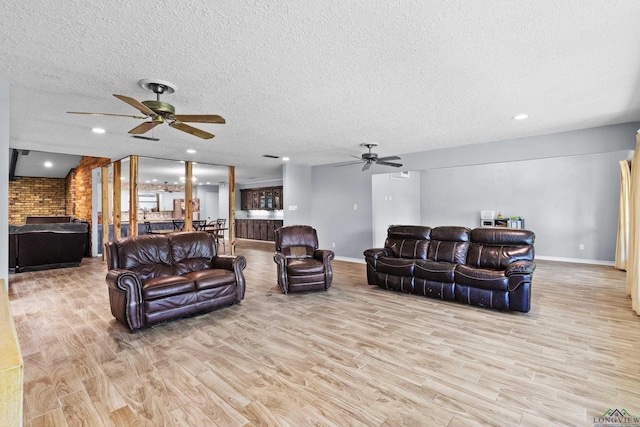 3955 E US Highway 79, Henderson, TX 75652 - living room with ceiling fan, wood finished floors, baseboards, a textured ceiling, and recessed lighting