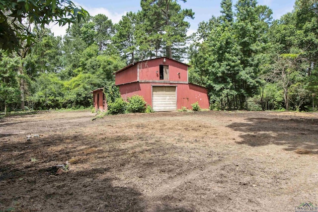 3955 E US Highway 79, Henderson, TX 75652 - view of yard featuring a detached garage, an outdoor structure, and driveway