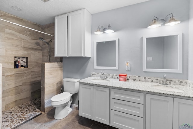 3955 E US Highway 79, Henderson, TX 75652 - bathroom featuring toilet, double vanity, and a tile shower