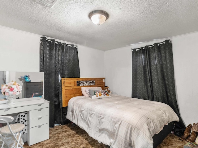 carpeted bedroom with a textured ceiling