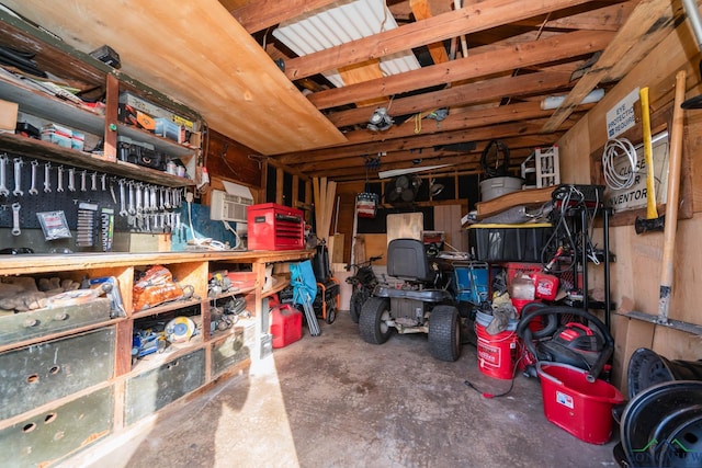 storage room featuring an AC wall unit