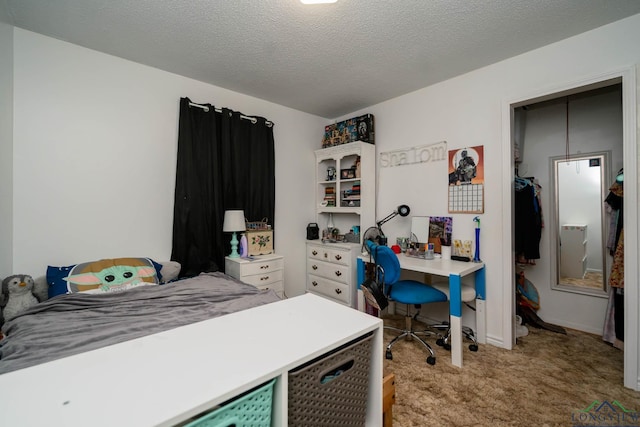 office featuring a textured ceiling and light colored carpet