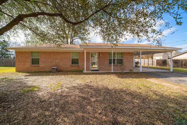 view of front of property featuring a carport