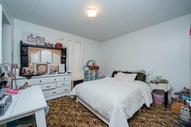 bedroom featuring a textured ceiling