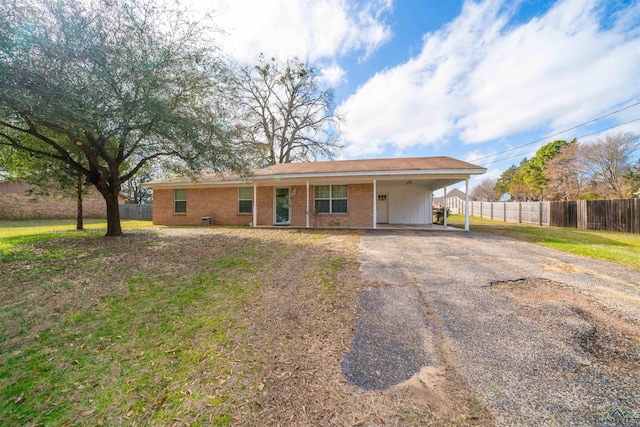 single story home featuring a carport