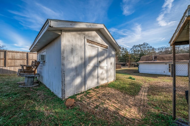 view of outbuilding featuring a yard