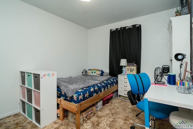 carpeted bedroom featuring a textured ceiling