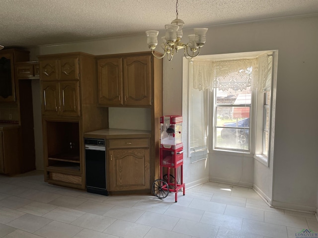 kitchen featuring pendant lighting, a chandelier, and a textured ceiling