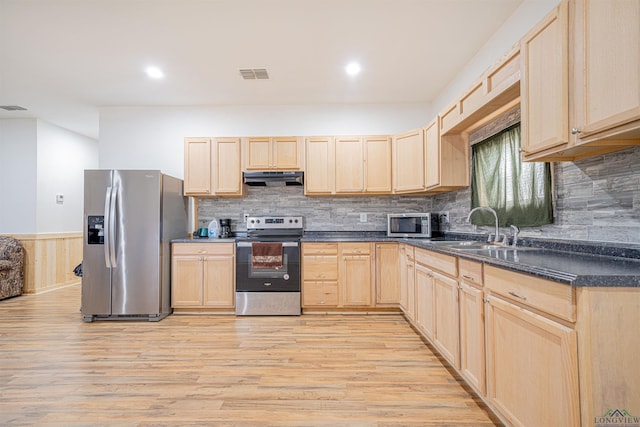 kitchen featuring light brown cabinetry, sink, and appliances with stainless steel finishes