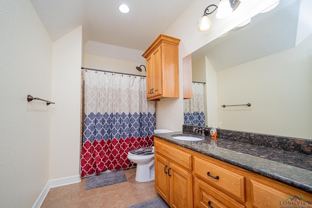 bathroom with vanity, tile patterned floors, and toilet