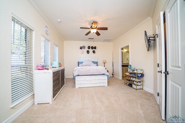 carpeted bedroom featuring ceiling fan and ornamental molding