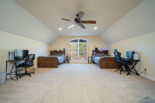 bedroom featuring ceiling fan, vaulted ceiling, and light carpet