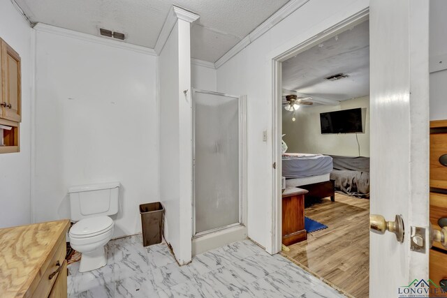 212 W W Ctr, White Oak, TX 75693 - ensuite bathroom featuring a stall shower, ornamental molding, a ceiling fan, and vanity