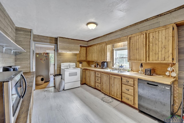 212 W W Ctr, White Oak, TX 75693 - kitchen featuring white electric range, dishwashing machine, wooden walls, freestanding refrigerator, and light countertops