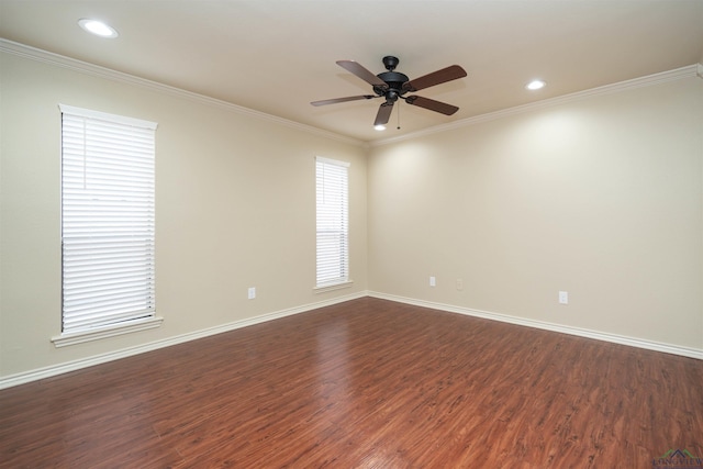 empty room with crown molding, ceiling fan, and dark hardwood / wood-style floors