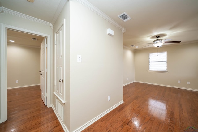 interior space featuring ornamental molding and dark hardwood / wood-style floors