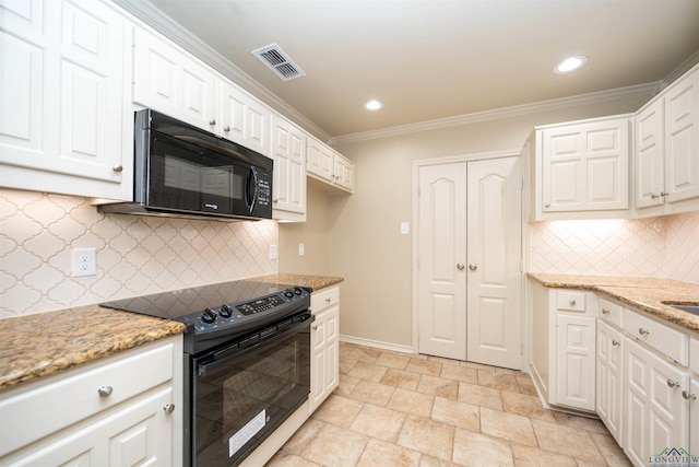 kitchen featuring white cabinetry, light stone countertops, and black appliances