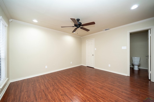 empty room with crown molding, dark wood-type flooring, and ceiling fan