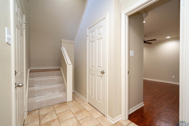 stairway with ceiling fan