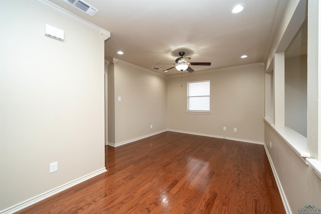 empty room featuring crown molding, dark hardwood / wood-style floors, and ceiling fan