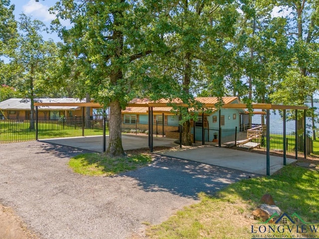 263 Crestwood Loop, Avinger, TX 75630 - surrounding community with driveway and a gate