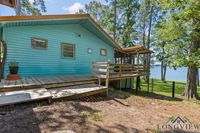 263 Crestwood Loop, Avinger, TX 75630 - rear view of property with a deck with water view