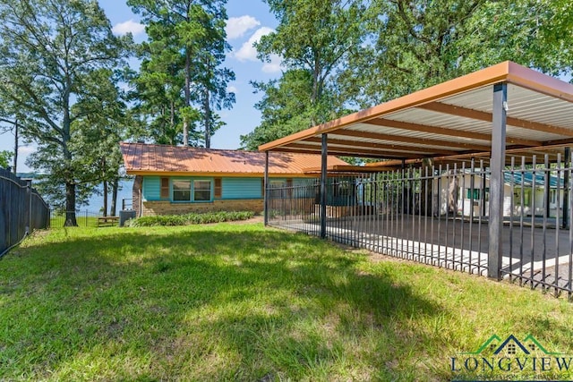 263 Crestwood Loop, Avinger, TX 75630 - rear view of house featuring a metal roof