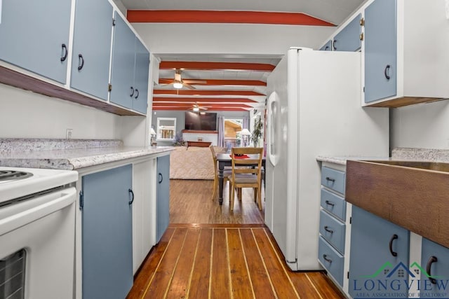 263 Crestwood Loop, Avinger, TX 75630 - kitchen with blue cabinets, ceiling fan, stove, dark wood-type flooring, and light countertops