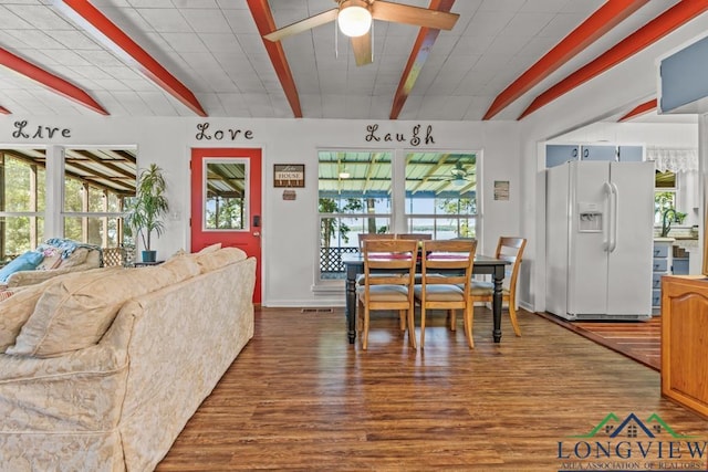 263 Crestwood Loop, Avinger, TX 75630 - dining space with beam ceiling, wood finished floors, and a ceiling fan