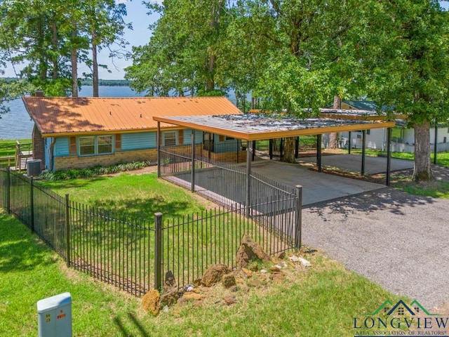 263 Crestwood Loop, Avinger, TX 75630 - view of property's community with driveway, a water view, and a detached carport